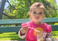 Little Girl Eating Ice cream Outdoor