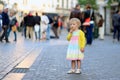 Little girl eating ice cream walking in the city Royalty Free Stock Photo