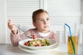 Little girl eating pasta for dinner at restaurant Royalty Free Stock Photo