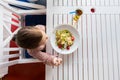 Little girl eating pasta for dinner at restaurant Royalty Free Stock Photo