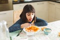 Little girl eating pasta at home Royalty Free Stock Photo