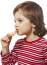 little girl eating piece of pizza