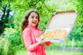 Little girl eating pizza. pizza delivery. unhealthy and healthy food. happy childhood. child feel hunger. hungry kid Royalty Free Stock Photo