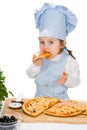 Little girl eating pizza