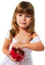 Little girl eating pomegranate