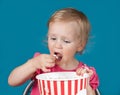 Little girl eating popcorn Royalty Free Stock Photo