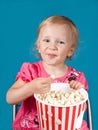 Little girl eating popcorn Royalty Free Stock Photo