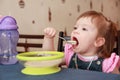 Little girl eating porridge