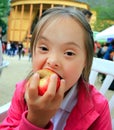 Little girl eating red apple Royalty Free Stock Photo