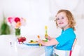 Little girl eating salad for lunch Royalty Free Stock Photo