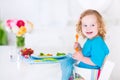 Little girl eating salad for lunch Royalty Free Stock Photo