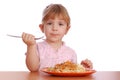 Little girl eating spaghetti