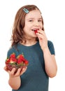 Little girl eating strawberries Royalty Free Stock Photo