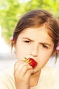 little girl eating strawberries Royalty Free Stock Photo