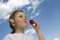 Little girl eating strawberry Royalty Free Stock Photo