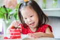 Little girl eating strawberry cake Royalty Free Stock Photo