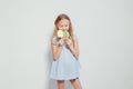 Little girl eating sweet candy lollipop on a stick Royalty Free Stock Photo