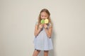 Little girl eating sweet candy lollipop on a stick Royalty Free Stock Photo