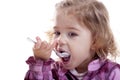 Little girl eating yogurt. Royalty Free Stock Photo