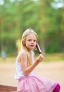 Little girl eats stick ice cream bar eskimo pie Royalty Free Stock Photo