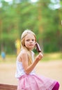 Little girl eats stick ice cream bar eskimo pie Royalty Free Stock Photo