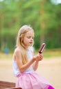 Little girl eats stick ice cream bar eskimo pie Royalty Free Stock Photo