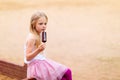 Little girl eats stick ice cream bar eskimo pie Royalty Free Stock Photo