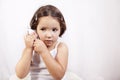 Little girl with electronic thermometer Royalty Free Stock Photo