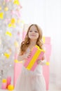 Little girl in an elegant dress presents a gift Royalty Free Stock Photo