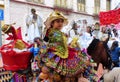 Little girl in embroidered costume riding horse, Ecuador