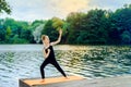 Little girl is engaged in martial arts at sunset Royalty Free Stock Photo