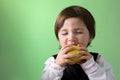 Little girl enjoying apple Royalty Free Stock Photo