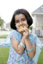 Little girl enjoying cookie