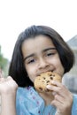 Little girl enjoying cookie