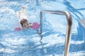 Little girl enjoying swimming pool indoors Royalty Free Stock Photo