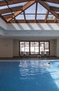 Little girl enjoying swimming pool indoors Royalty Free Stock Photo