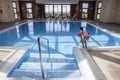 Little girl enjoying swimming pool indoors Royalty Free Stock Photo