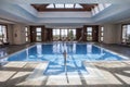 Little girl enjoying swimming pool indoors Royalty Free Stock Photo