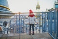 Little girl enjoying view to Parisian skyline with roofs