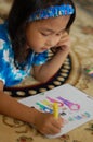 A Little girl Enjoys Coloring