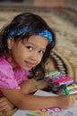 A Little girl Enjoys Coloring