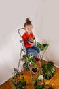 Little girl enjoys a grown cactus.