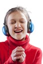 Little girl enjoys music, close-up portrait