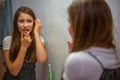 Little girl experiences toothache after brushing her teeth Royalty Free Stock Photo