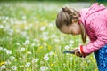 Little girl exploring nature with her smartphone Royalty Free Stock Photo