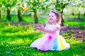 Little girl in fairy costume feeding a bird Royalty Free Stock Photo