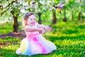 Little girl in fairy costume feeding a bird Royalty Free Stock Photo