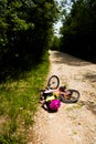 Little girl falling off her bicycle