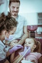 Little girl with father at dentist. Royalty Free Stock Photo