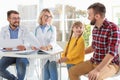 Little girl with father visiting children`s doctors